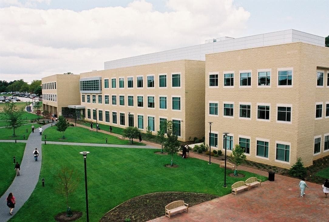 The Howard Community College campus in Columbia, Maryland in the early 2000s, students walking past the newly completed Instructional Laboratory Building